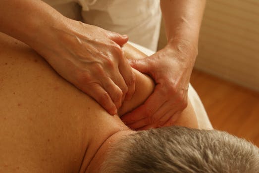 pexels photo 275768 275768 2 Close-up of a therapist giving a relaxing shoulder massage, enhancing wellness and stress relief.